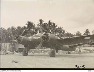 LOS NEGROS ISLAND, ADMIRALTY ISLANDS. C. 1944. BEAUFIGHTER AIRCRAFT A8-247 OF NO. 30 SQUADRON RAAF ON THE AIRSTRIP AT MOMOTE. THE AIRCRAFT WAS NAMED "BRIDGETOWN" TO HONOUR THAT TOWN'S EFFORT IN ..