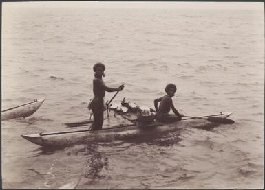 Reef Islanders in canoe, Reef Islands, Swallow Group, Solomon Islands, 1906 / J.W. Beattie