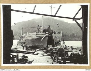 KWIARA, CHINA STRAITS, 1943-07-06. THE 016-2 ON THE SLIPS FOR REPAIRS AT THE 1ST AUSTRALIAN WATER TRANSPORT GROUP MAINTENANCE BASE