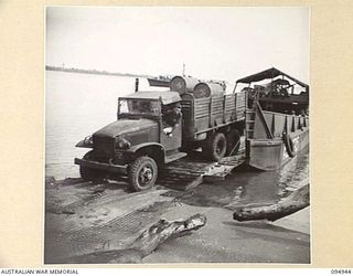 CAPE WOM, WEWAK AREA, NEW GUINEA. 1945-08-07. TROOPS OF HEADQUARTERS COMMAND, AUSTRALIAN ARMY SERVICE CORPS, 6 DIVISION, TRANSPORTING STORES TO FORWARD AREAS. WHEN BRIDGES ARE DOWN, WHERE ..