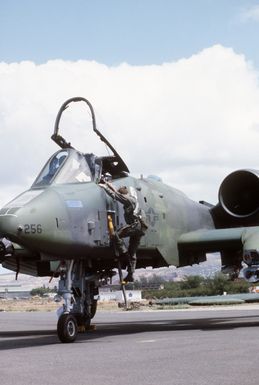 A pilot of the 18th Tactical Fighter Squadron, 343rd Tactical Fighter Wing, climbs out of the cockpit of an A-10A Thunderbolt II aircraft after a mission during Exercise OPPORTUNE JOURNEY 85-3