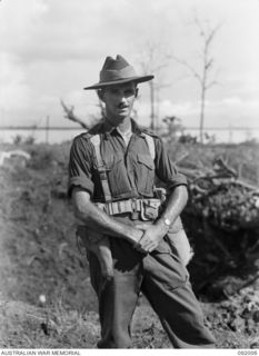 WEWAK POINT, NEW GUINEA, 1945-05-12. LT-COL G.S. COX, COMMANDING OFFICER 2/4 INFANTRY BATTALION AT BATTALION HQ AFTER THE BATTLE FOR WEWAK