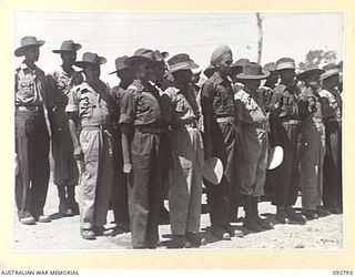 LAE, NEW GUINEA. 1945-06-09. INDIAN TROOPS, EVACUATED PRISONERS OF WAR WHO HAVE BEEN RECUPERATING AT 2/7 GENERAL HOSPITAL, BEING CHECKED OFF PRIOR TO MOVEMENT TO THE HOSPITAL SHIP MANUNDA