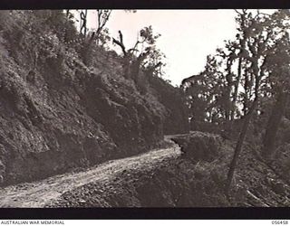 REINHOLD HIGHWAY, NEW GUINEA. 1943-08-24. PORTION OF THE MOUNTAIN ROAD CONSTRUCTED BY THE TROOPS OF HEADQUARTERS, ROYAL AUSTRALIAN ENGINEERS, 11TH AUSTRALIAN DIVISION BETWEEN JOHNSON'S GAP AND EDIE ..