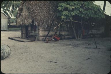 Showing details of houses: note coconut-scraping stool (3) : Mortlock Islands, Papua New Guinea, 1960 / Terence and Margaret Spencer