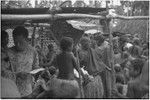 Mortuary ceremony, Omarakana: elderly woman and other mourning women participate in ritual exchange of banana leaf bundles