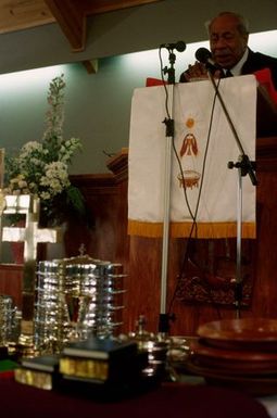 King Taufa'ahau Tupou IV speaking from the pulpit at the dedication of Vaine Mo'onia (The True Vine) church