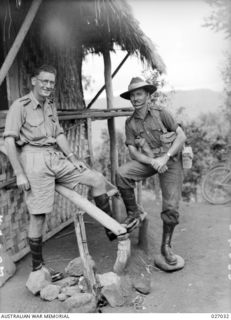 PAPUA, NEW GUINEA. 1942-10. MAJOR A. G. CAMERON, ACTING COMMANDING OFFICER OF THE 39TH AUSTRALIAN INFANTRY BATTALION (RIGHT) AND CHAPLAIN FOURTH CLASS REVEREND N. J. KARL, PADRE OF THE BATTALION ..