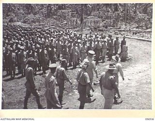 MUSCHU ISLAND, NEW GUINEA. 1945-09-24. MAJOR GENERAL H.C.H. ROBERTSON, GENERAL OFFICER COMMANDING 6 DIVISION, ACCOMPANIED BY SENIOR OFFICERS INSPECTING JAPANESE ARMY PERSONNEL. HE WILL INSPECT ALL ..