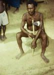 Sepik man listening to campaign speech by a New Guinean candidate for House of Assembly, Wewak subdistrict, 1964
