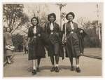 Papua Girl Guides Keke Reva, Vagi Varo and Rakatam Hilolo walking through Railway Park, Sydney, 25 Aug 1951