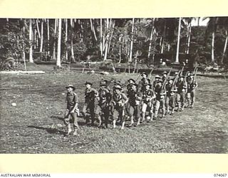 SIAR, NEW GUINEA. 1944-06-21. PERSONNEL OF NO. 7 PLATOON, A COMPANY, 57/60TH INFANTRY BATTALION, MARCHING OFF THE UNIT PARADE GROUND. IDENTIFIED PERSONNEL ARE:- VX14600 LIEUTENANT L. TALBOT (1); ..