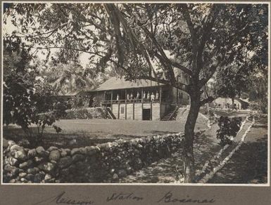 Mission Station, Boianai [people standing on verandah] Frank Hurley