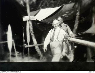 AITAPE, NORTH EAST NEW GUINEA. C. 1944-06. ARTHUR DRAKEFORD, THE MINISTER FOR AIR, AND AIR COMMODORE F. R. W. SCHERGER, THE AIR OFFICER COMMANDING NO. 10 GROUP RAAF, AT HEADQUARTERS NO. 10 GROUP ..