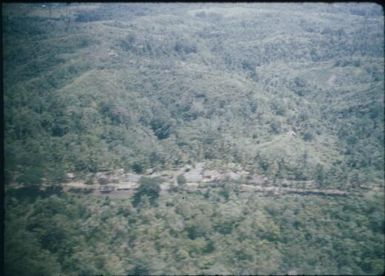 Maprik foothills showing village : Wewak-Maprik, Papua New Guinea,1959 / Terence and Margaret Spencer