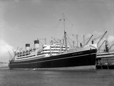 The Dominion Monarch at a wharf in Wellington