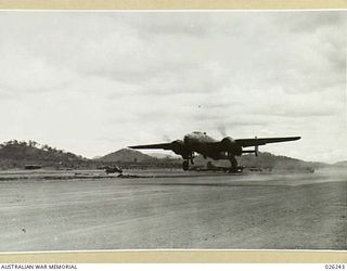 New Guinea, 1942-08-10. A North American B25 Mitchell bomber aircraft taking off for a raid over Japanese occupied territory