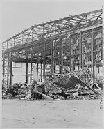 Naval photograph documenting the Japanese attack on Pearl Harbor, Hawaii which initiated US participation in World War II. Navy's caption: Burned and wrecked hangar at the Naval Air Station, Pearl Harbor, after the Japanese attack on Pearl Harbor on Dec. 7, 1941.