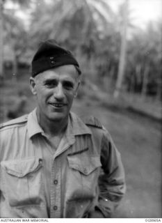 PORT MORESBY, PAPUA. C. 1943. PORTRAIT OF RAAF CHAPLAIN PADRE DEBENHAM WHO CONDUCTED HIS "LITTLE CHURCH AMONG THE COCONUTS"