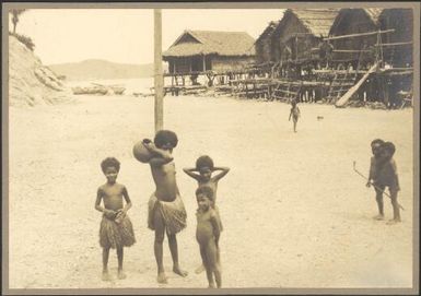 Elevala village children standing on a beach, Port Moresby, Papua, ca. 1923, 2 / Sarah Chinnery