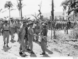 BLANCHE BAY, NEW BRITAIN. 1945-09-28. LIEUTENANT GENERAL J. NORTHCOTT, CHIEF OF GENERAL STAFF ACCOMPANIED BY MAJOR GENERAL K.W. EATHER, GENERAL OFFICER COMMANDING 11 DIVISION MEET MAJOR L.F. ..