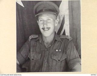 CAPE WOM, WEWAK AREA, NEW GUINEA. 1945-10-17. LIEUTENANT E. NORMAN, ASSISTANT CAMP COMMANDANT, HEADQUARTERS 6 DIVISION