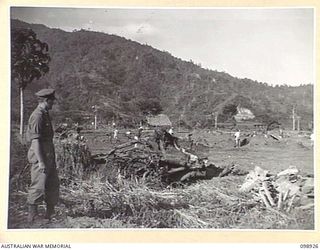 RABAUL, NEW BRITAIN. 1945-11-16. JAPANESE WORKING PARTY CLEARING THE BASE COMMANDANT'S AREA AT HEADQUARTERS 5 BASE SUB AREA