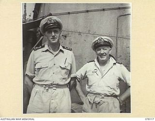 MADANG, NEW GUINEA. 1944-11-20. TWO OF THE OFFICERS OF THE ROYAL AUSTRALIAN NAVY VESSEL, HMAS "BENDIGO" ABOARD THEIR SHIP