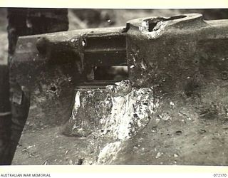 FORTIFICATION POINT, NEW GUINEA. 1944-04-08. THE EFFECT OF THREE ROUNDS OF ARMOUR PIERCING PROJECTILE FIRED FROM A RANGE OF 150 YARDS BY MEMBERS OF THE 2/14TH FIELD REGIMENT USING A CAPTURED ..