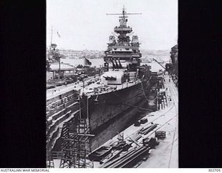 SYDNEY, NSW. 1942-12. PORT BOW VIEW OF THE HEAVY CRUISER USS PORTLAND (CA-33) IN SUTHERLAND DOCK AT COCKATOO ISLAND REPAIRING DAMAGE SUSTAINED DURING THE NIGHT ACTION OFF GUADALCANAL THE PREVIOUS ..