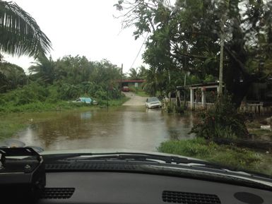 Photo taken from inside car through the windshield of a flooded road in Guam due to tropical storm Halong that occurred from July 28 to July 31, 2014. Photo by Samuel Ronveaux FEMA