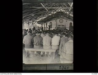 TOROKINA, BOUGAINVILLE ISLAND, SOLOMON ISLANDS. 1945-08-16. THE CONGREGATION AT A THANKSGIVING SERVICE FOR RAAF PERSONNEL HELD IN THE CHURCH OF ENGLAND CHAPEL, CONDUCTED BY PADRE ROSS BORDER OF ..