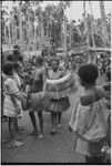 Mortuary ceremony, Omarakana: procession of mourning women holding fiber skirt valuables