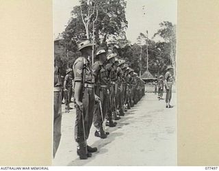TOROKINA, BOUGAINVILLE ISLAND. 1944-12-06. TROOPS OF A COMPANY, 15TH INFANTRY BATTALION ON PARADE FOR AN INSPECTION BY THE GENERAL OFFICER COMMANDING, 3RD AUSTRALIAN DIVISION. IDENTIFIED PERSONNEL ..