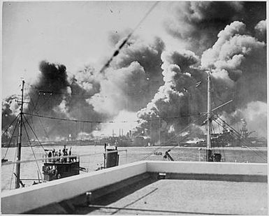 Naval photograph documenting the Japanese attack on Pearl Harbor, Hawaii which initiated US participation in World War II. Navy's caption: USS SHAW burning after being hit during the Japanese attack on Dec. 7, 1941.