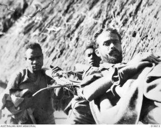 1943-04-08. NEW GUINEA. PTE. G.E.G. BUTLER, WHO AFTER HE HAD BEEN MISSING FOR NINE WEEKS IN THE MUBO AREA, MADE HIS WAY BACK TO THE AUSTRALIAN LINES. DURING ALL THAT TIME HE WAS BEHIND THE JAPANESE ..