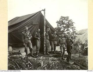 RAMU VALLEY, NEW GUINEA, 1944-03-27. OFFICERS OF HEADQUARTERS, 15TH INFANTRY BRIGADE. IDENTIFIED PERSONNEL ARE: VX81104 LIEUTENANT F.J. WATT, 57/60TH INFANTRY BATTALION (1); VX52501 LIEUTENANT E. ..