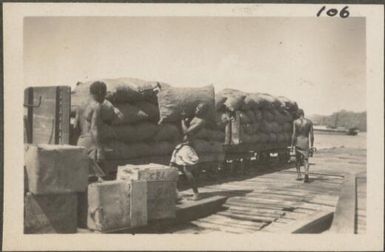 Unloading copra at the pier, Rabaul, New Britain Island, Papua New Guinea, probably 1916