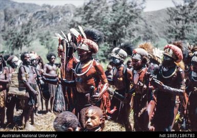 Mendi men and children standing in a group