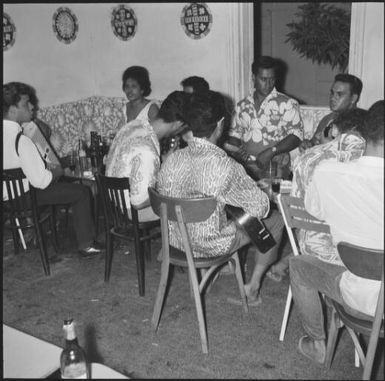 Group of people with guitars in a bar, Noumea, New Caledonia, 1967, 1 / Michael Terry