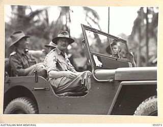 TOL PLANTATION, WIDE BAY, NEW BRITAIN. 1945-07-02. HIS ROYAL HIGHNESS, THE DUKE OF GLOUCESTER, GOVERNOR-GENERAL OF AUSTRALIA (2), IN HIS JEEP IN TOL PLANTATION. THE GOVERNOR-GENERAL IS VISITING ..