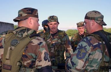 New Hampshire Air National Guard 157th Air Refueling Wing Security Forces personnel receive a briefing prior to a training exercise at Hickam Air Base, Hawaii, on Jan. 25, 2005.(U. S. Air Force PHOTO by STAFF SGT. Dawn Finniss) (Released)