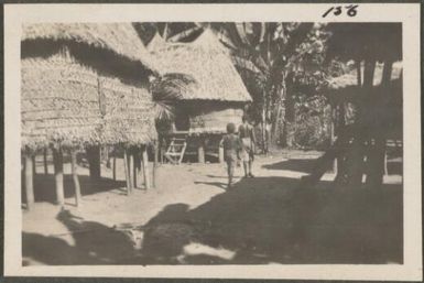Village huts, New Britain Island, Papua New Guinea, probably 1916