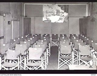 LAE, NEW GUINEA, 1945-12-21. THE AUDITORIUM OF THE AUSTRALIAN ARMY AMENITIES SERVICE RADIO STATION 9AB