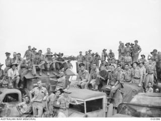 KIRIWINA, TROBRIAND ISLANDS, PAPUA. C. 1943-11-30. AN INFORMAL GROUP PORTRAIT OF MEMBERS OF NO. 6 MOBILE WORKS SQUADRON RAAF TAKEN ON THE DECK OF THE SHIP JUST BEFORE DEPARTURE FROM KIRIWINA TO ..