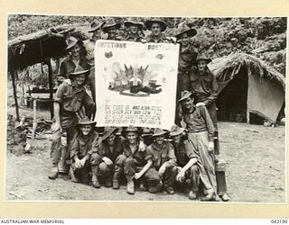 DUMPU, NEW GUINEA. 1943-12-10. AUSTRALIAN IMPERIAL FORCE TROOPS IN NEW GUINEA CONVEYING THEIR CHRISTMAS GREETINGS TO ALL THE FOLKS AT HOME