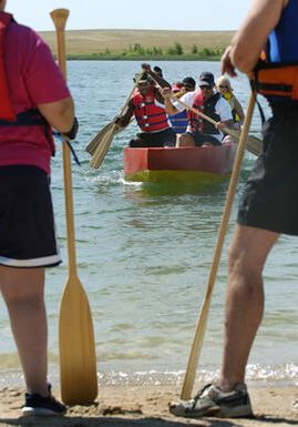 Aurora, CO July 19, 2005 Members of Team Imua Polynesia paddles into shore after a training sesion at Aurora Resevoir. . They're preparing for next week's dragon boat races. Rick Giase/Special to the News