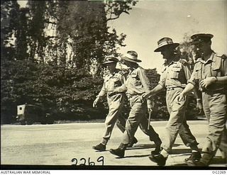 TOROKINA, BOUGAINVILLE ISLAND, SOLOMON ISLANDS. 1945-02-18. WALKING ALONG THE TAXIWAY OF PIVA AIRFIELD TO INSPECT BEAUFORT AIRCRAFT AND ANSON AIRCRAFT OF NO. 10 COMMUNICATION UNIT RAAF. LEFT TO ..