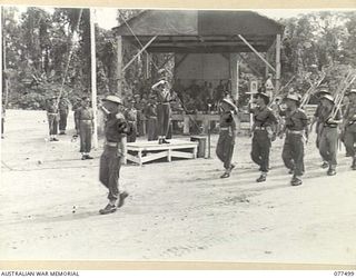 TOROKINA, BOUGAINVILLE ISLAND. 1944-12-06. VX38969 MAJOR-GENERAL W. BRIDGEFORD, CBE, MC, GOC, 3RD DIVISION (1) TAKING THE SALUTE AS THE TROOPS OF THE 15TH INFANTRY BATTALION MOVE PAST THE SALUTING ..