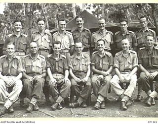 KILIGIA, NEW GUINEA, 1944-03-16. OFFICERS OF HEADQUARTERS, 5TH DIVISION SIGNALS SECTION. IDENTIFIED PERSONNEL ARE: QX39400 CAPTAIN A.J. HARLEN (1); VX47627 CAPTAIN G.P. HARPER (2); QX40794 MAJOR F. ..